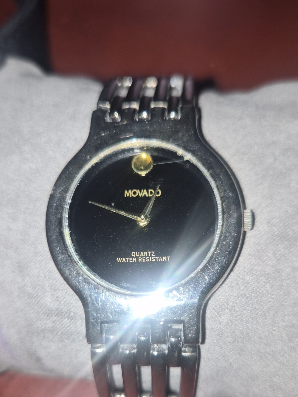Movado Black Dial Silver Bracelet Watch with Gold Accents